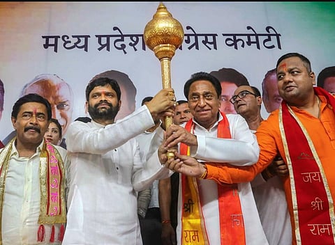 Madhya Pradesh Congress President Kamal Nath is presented a mace by the National President of Bajrang Sena Ranbeer Pateriya (2L), at PCC headquarters in Bhopal, June 6, 2023. (PTI)