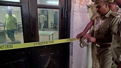 Uttar Pradesh Police seal a crime scene at the Lucknow Civil Court where gangster Sanjeev Jeeva was shot dead, in Lucknow on Wednesday. (Photo | ANI)