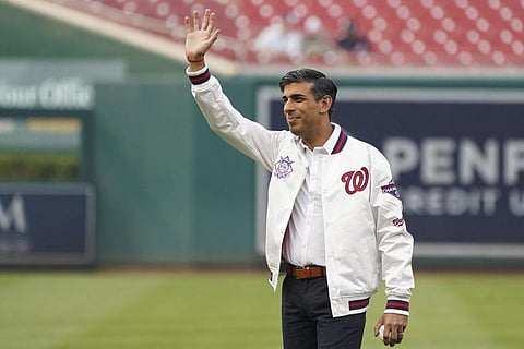 British Prime Minister Rishi Sunak waves to spectators as he attends a Washington Nationals baseball game during his visit to Washington, Wednesday, June 7, 2023. (Photo | AP)