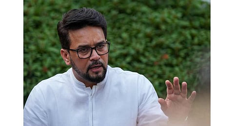 Union Minister for Youth Affairs and Sports Anurag Thakur addresses a press conference after a meeting with wrestlers, in New Delhi. (Photo | PTI)
