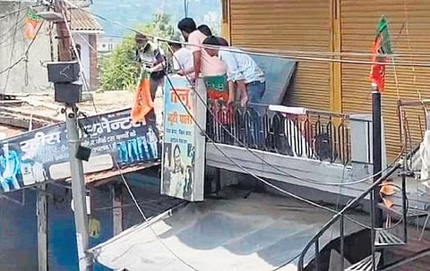 Trade unions, Hindu unit’s activists remove boards from Muslim shops. (Photo | EPS)
