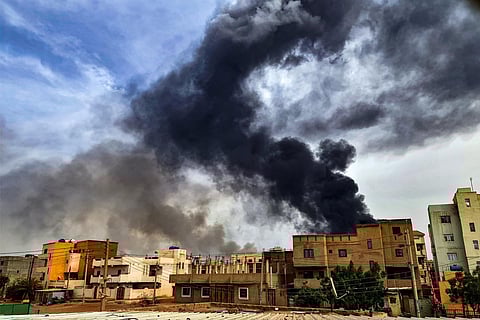 Smoke plumes billow from a fire at a lumber warehouse in southern Khartoum amidst ongoing fighting on June 7, 2023. (Photo | AFP)