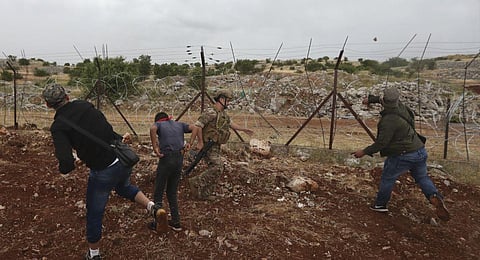Lebanese protesters throw stones at Israeli troops on the outskirts of Kfarchouba. (Photo | AP)