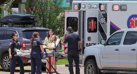 A member of Bayou City Fellowship Youth Group is prepared to be taken to the hospital. (Photo | AP)