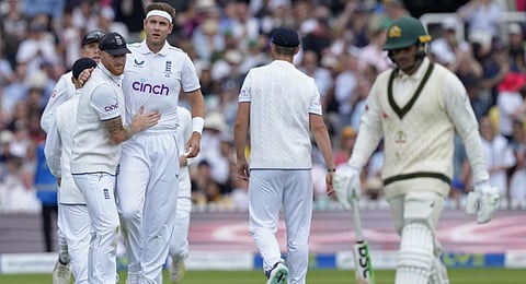 England's captain Ben Stokes hugs teammate Stuart Broad for dismissing Australia's Usman Khawaja. (Photo | AP)