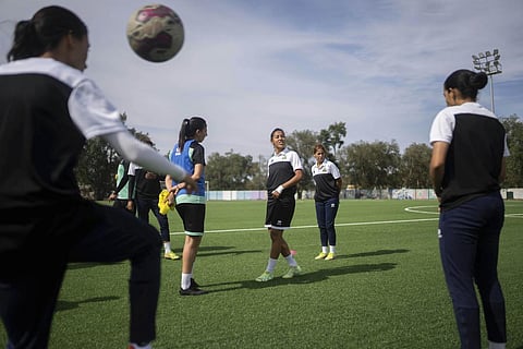 Women players of ASFAR soccer team take part in a training session ahead of a league match