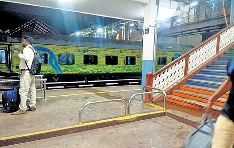 Steel bars temporarily put up on Platform 7 of KSR Railway Station to caution passengers will be replaced with a ramp soon | Express