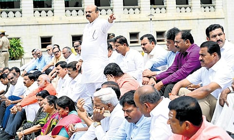 BJP leaders, including former chief minister Basavaraj Bommai, protest near the Mahatma Gandhi statute outside Vidhana Soudha in Bengaluru on Wednesday before taking out a padayatra to the Raj Bhavan