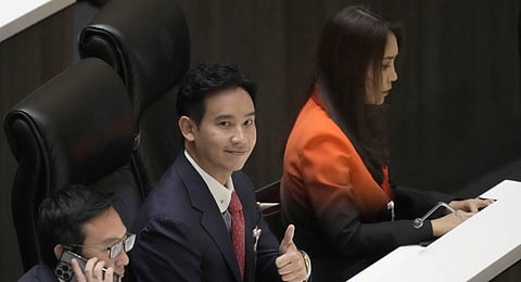 Pita Limjaroenrat, the leader of Move Forward Party and top winner in the May's general election gestures at the Parliament, in Bangkok, Thailand. (Photo | PTI)