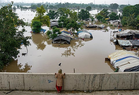 Swollen Yamuna river floods low-lying areas after heavy monsoon rain, in New Delhi (Photo | PTI)
