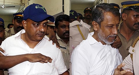 Two of the three PFI activists who were granted life imprisonment by the NIA court for chopping off the hand of professor T J Joseph being taken to jail from the court on Thursday. (Photo | A Sanesh)