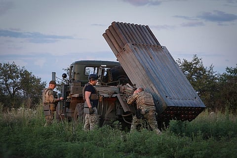Ukrainian soldiers prepare a Grad multiple rocket launcher to fire rockets at the Russian positions in the frontline near Bakhmut, Donetsk region, Ukraine, Wednesday, July 12, 2023. (Photo | AP)
