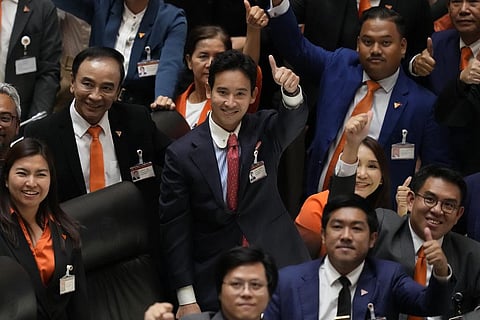 Pita Limjaroenrat (C), the leader of Move Forward Party and top winner in May's general election, gestures after the vote counting at the Parliament in Bangkok, July 13, 2023. (Photo | AP)