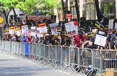 Writers and actors join forces as they walk the picket line during a strike, Friday, July 14, 2023, at NBC Universal Studios in New York. (Photo | AP)