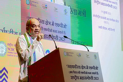 Union Home Minister Amit Shah addresses the national mega conclave on ‘Strengthening PACS through FPOs’ in New Delhi on Friday. (Photo | PTI)