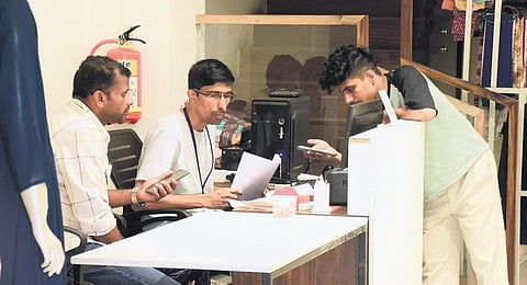 State GST intelligence wing officials raiding shops at SM Street in connection with tax irregularities. (Photo | Express)