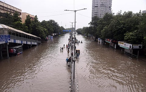 Commuters move through a waterlogged road at ITO, in New Delhi, Friday, July 14, 2023.  (Photo |Parveen Negi, EPS)