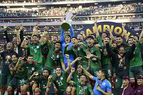 Mexico players celebrate with the winner's trophy after beating Panama 1-0 after the CONCACAF Gold Cup final soccer match Sunday, July 16, 2023. (Photo | AP)