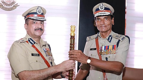 New state police chief Shaik Darvesh Saheb receiving the baton from Anil Kant, who retired as the Kerala police chief. (Photo | Express)