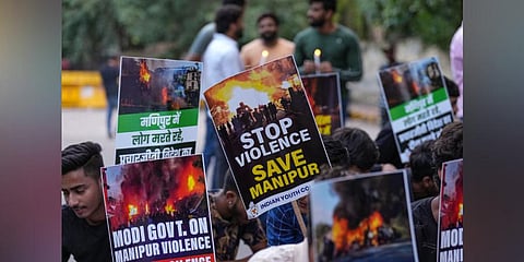 Indian Youth Congress supporters during a candle march to pay tribute to those who killed in Manipur violence, at Jantar Mantar in New Delhi. (Photo | PTI)