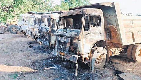 Nine vehicles which were torched  by Maoists; Arms dump unearthed in Malkangiri | Express