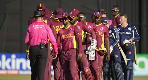 West Indies players shake hands after loosing to Scotland in their ICC Men's Cricket World Cup Qualifier match. (Photo | AP)