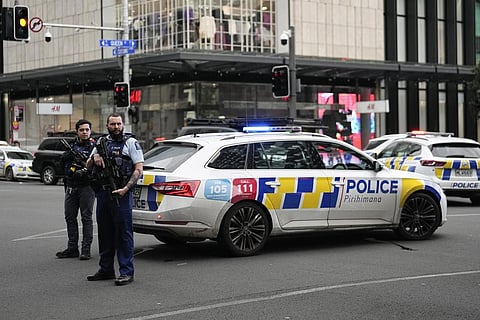 Armed New Zealand police officer stand at a road block in the central business district following a shooting in Auckland, New Zealand, Thursday, July 20, 2023.  (Photo | AP)