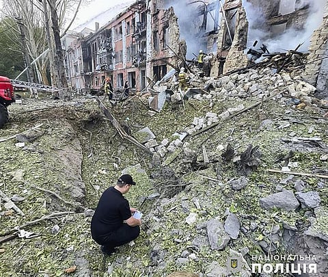 In this photo provided by the National Police of Ukraine, members of emergency services work at a building destroyed by a Russian attack in Mykolaiv, Ukraine, Thursday, July 20, 2023. (Photo | AP)