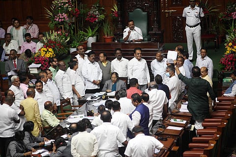 BJP legislators protest in the well of the Assembly on Wednesday. (Photo | Express)