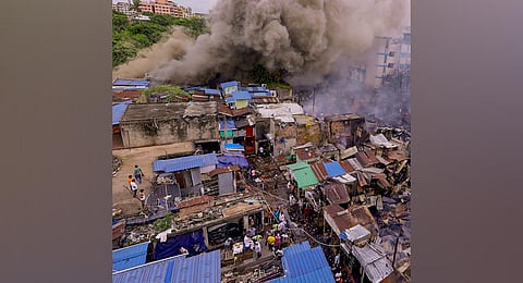 Smoke billows out after a fire broke out at Mangala Haat in Howrah district, Friday, July 21, 2023. (Photo | PTI)