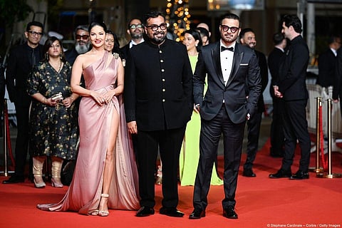 Director Anurag Kashyap and lead stars of his film 'Kennedy' Rahul Bhat and Sunny Leone made an appearance on the red carpet of the 76th Cannes Film Festival early Thursday morning in Cannes ahead of the movie's world premiere. (Photo |Festival de Cannes 