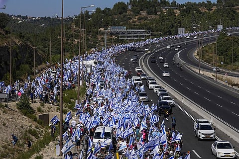 Thousands of Israelis march along a highway towards Jerusalem in protest of plans by Prime Minister Benjamin Netanyahu's government to overhaul the judicial system. (Photo | AP)