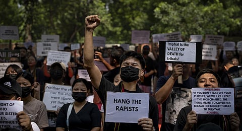 Kuki tribal protestors, in New Delhi, shout slogans during a demonstration against deadly ethnic clashes in Manipur, on Saturday, July 22, 2023. (Photo | AP)