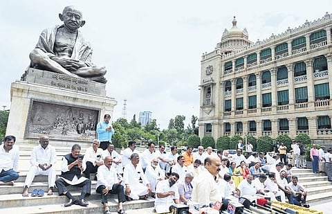 BJP leaders protest in front of the statue of Mahatma Gandhi outside Vidhana Soudha in Bengaluru  | Nagaraja Gadekal