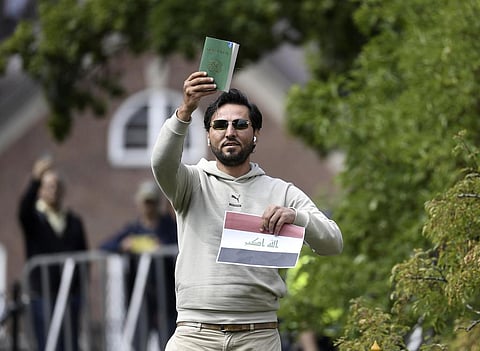 Protestor Salwan Momika appears outside the Iraqi embassy in Stockholm, Thursday, July 20, 2023, where he plans to burn a copy of the Quran and the Iraqi flag. (AP)