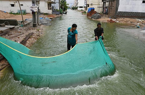 Locals cast a net to catch fis. (Photo | Vinay Madapu, EPS)