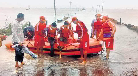Personnel of the National Disaster Relief Force rescue people trapped in flood-affected Mocha village in Gujarat on Sunday | ANI