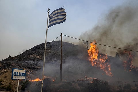 Flames burn a hill on the Aegean Sea island of Rhodes, southeastern Greece, on Monday, July 24, 2023. (Photo | AP)