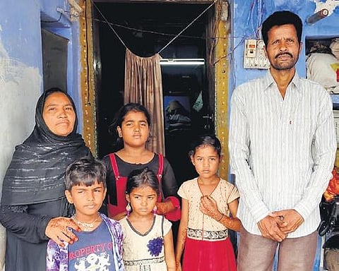 Pakistani national Gulzar Khan along with his wife and children