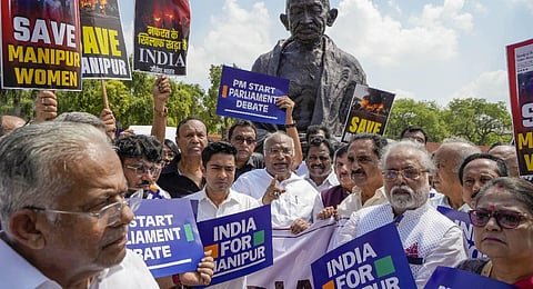Leader of the Opposition in Rajya Sabha Mallikarjun Kharge with other leaders of the INDIA alliance parties stage a protest over ethnic violence in Manipur. (Photo | PTI)