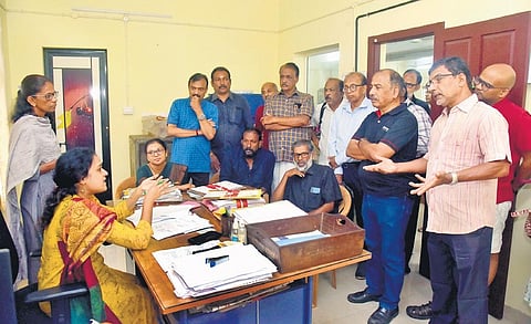 Residents led by Edappally councillor Deepa gheraoing an officer at Kaloor Water Authority in protest against water scarcity in the area | A Sanesh