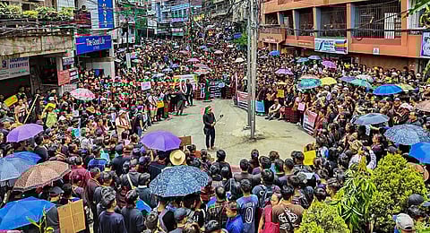 Civil society organisations stage a demonstration to express solidarity with the Zo people in ethnic strife-torn Manipur, in Aizawl.(Photo | PTI)