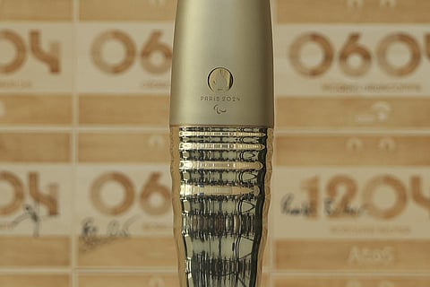 The Olympic torch is pictured during the IOC invitation ceremony, exactly one year before the 2024 Olympics, Wednesday, July 26, 2023 in Saint-Denis, outside Paris. (Photo | AP)