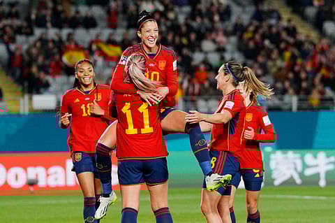 Spain's Jennifer Hermoso jumps into the arms of teammate Alexia Putellas celebrating after scoring her side's second goal against Zambia. (Photo | AP)
