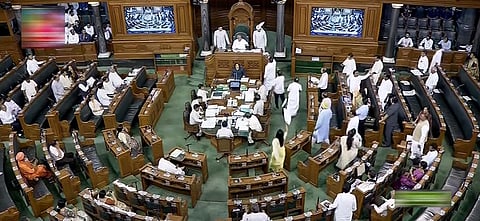 Opposition MPs protest in the Lok Sabha during the Monsoon session of Parliament, in New Delhi. (Photo | PTI)