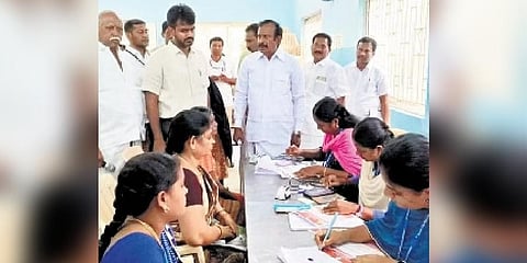 S Muthuswamy inspecting a registration centre for ‘Kalaignar Mahalir Urimai Thittam’ in Erode. Collector Raja Gopal Sunkara is also seen | Express