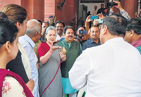 Congress MP Sonia Gandhi meets AAP MP Sanjay Singh on her arrival at Parliament House during the monsoon session on Wednesday  | PTI