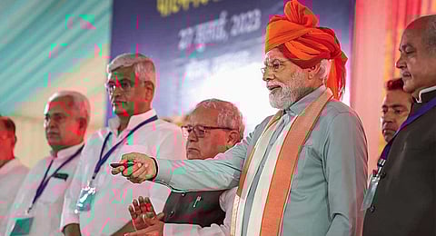 Prime Minister Narendra Modi with Rajasthan Governor and Union Ministers during the inauguration and foundation stone laying ceremony of various development projects, in Sikar on July 27, 2023. (PTI)