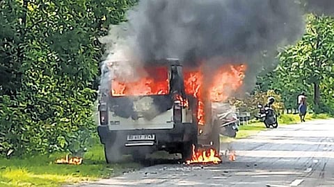 The police van engulfed in flames after being set afire by villagers | Express