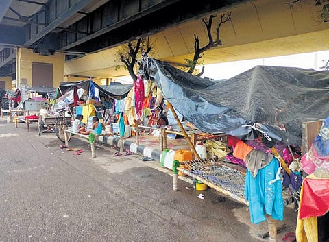 Flood-affected families take shelter under a flyover in New Delhi | Express